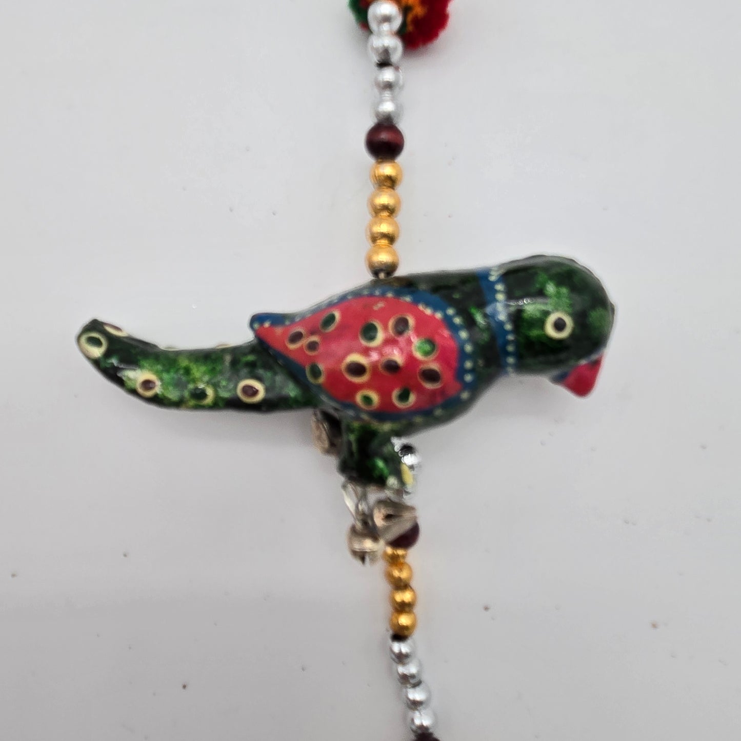 String of Parrots with Bell