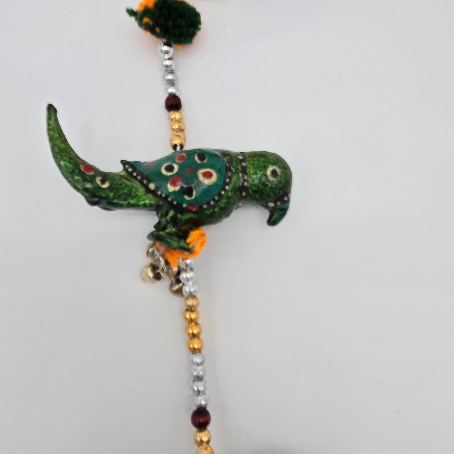String of Parrots with Bell