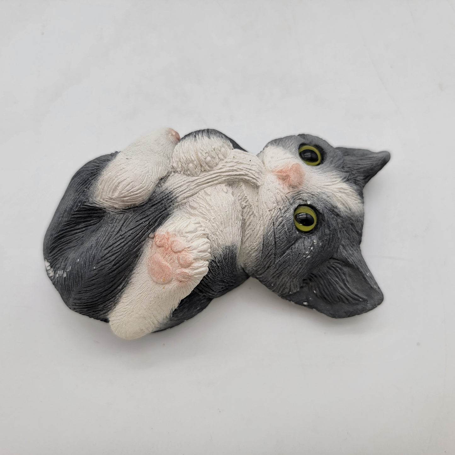 Adorable Black and White Kitten Biting Tail Figurine