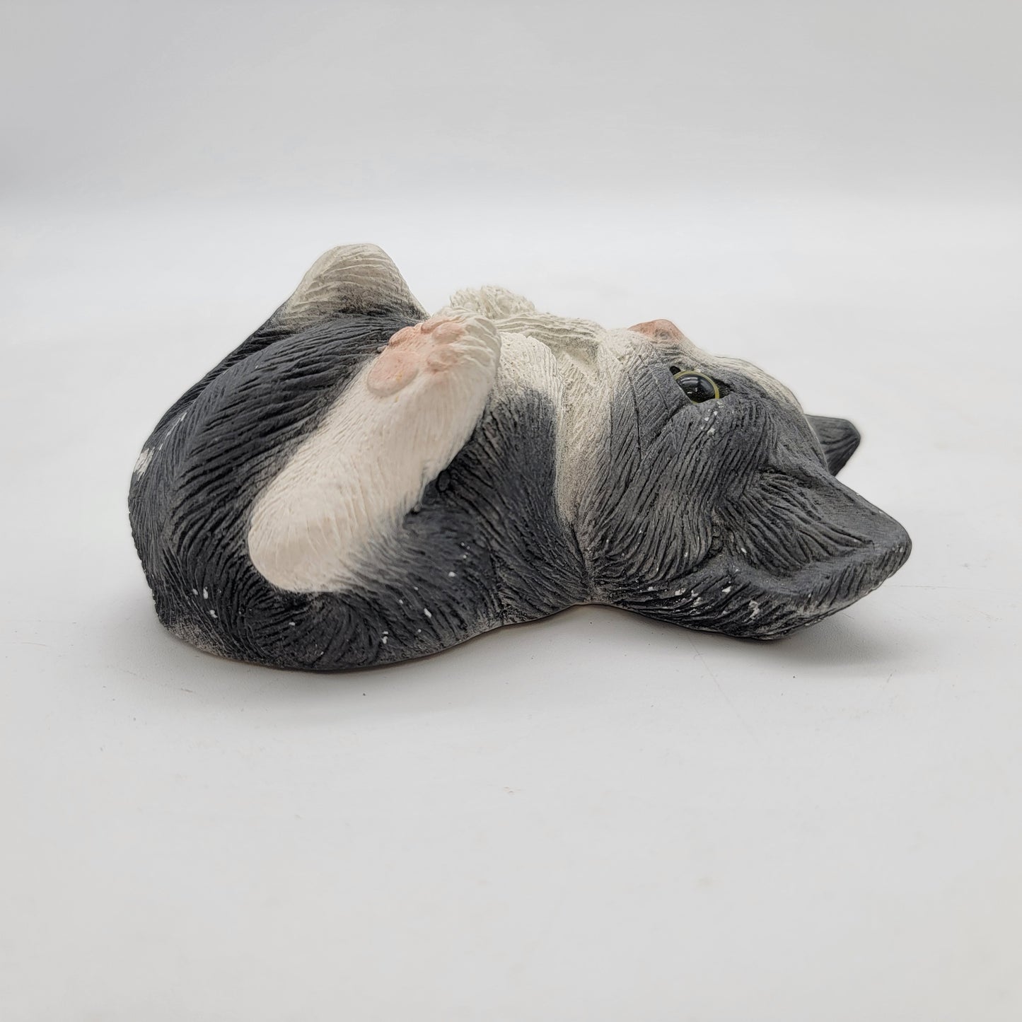Adorable Black and White Kitten Biting Tail Figurine