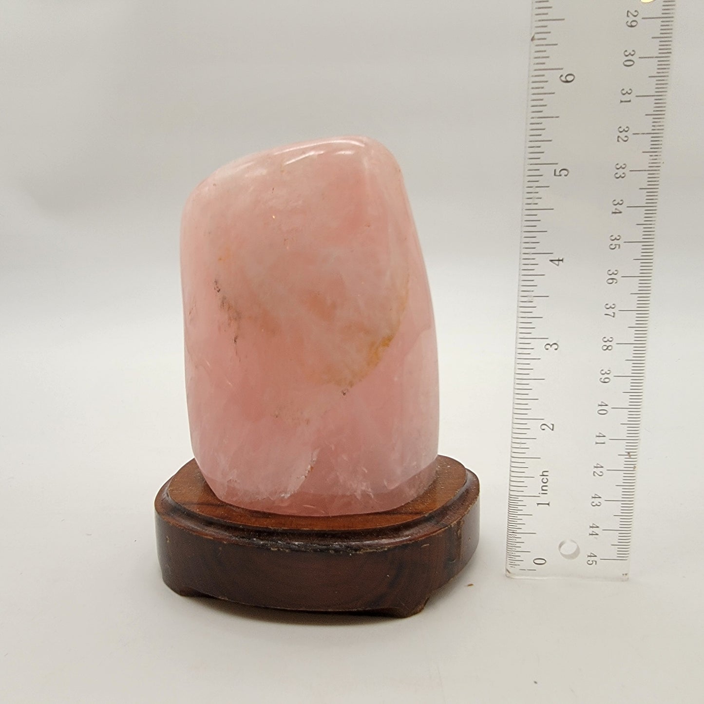 Polished Rose Quartz Crystal Specimen On Wooden Base