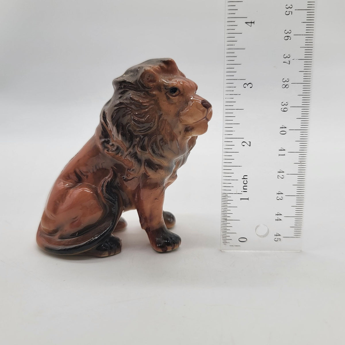 Mid-Century Porcelain Sitting Lion Figurine