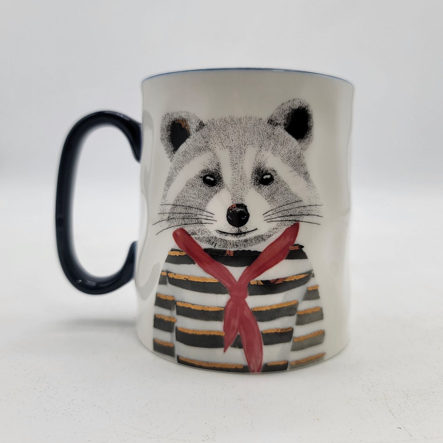 Raccoon-Themed Ceramic Mug With Navy Handle By Signature Housewares