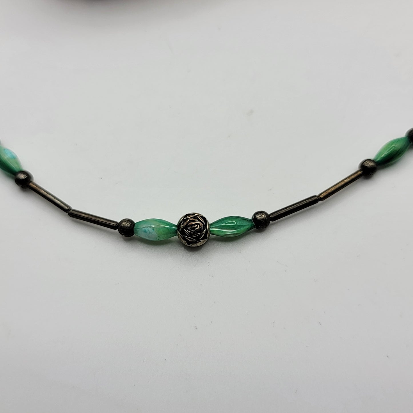 Liquid Silver Beaded Necklace with Green Accents