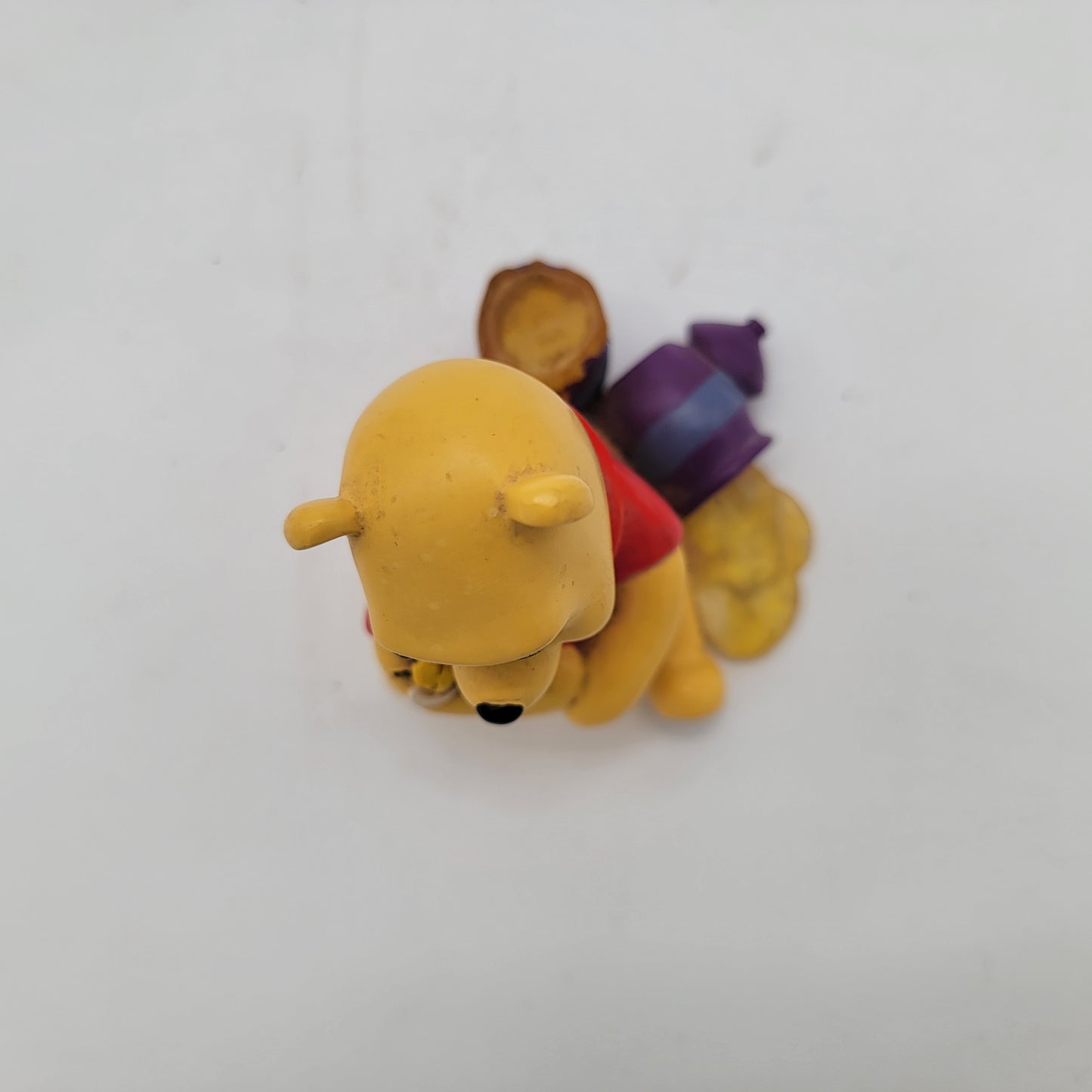 Winnie the Pooh Holding Bee Figurine