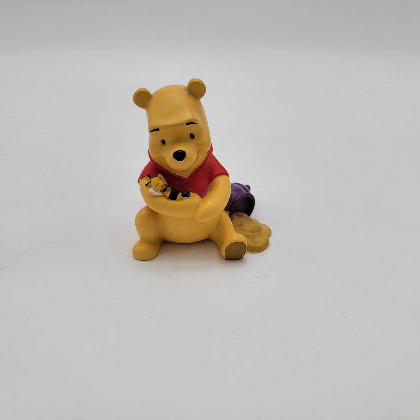 Winnie the Pooh Holding Bee Figurine