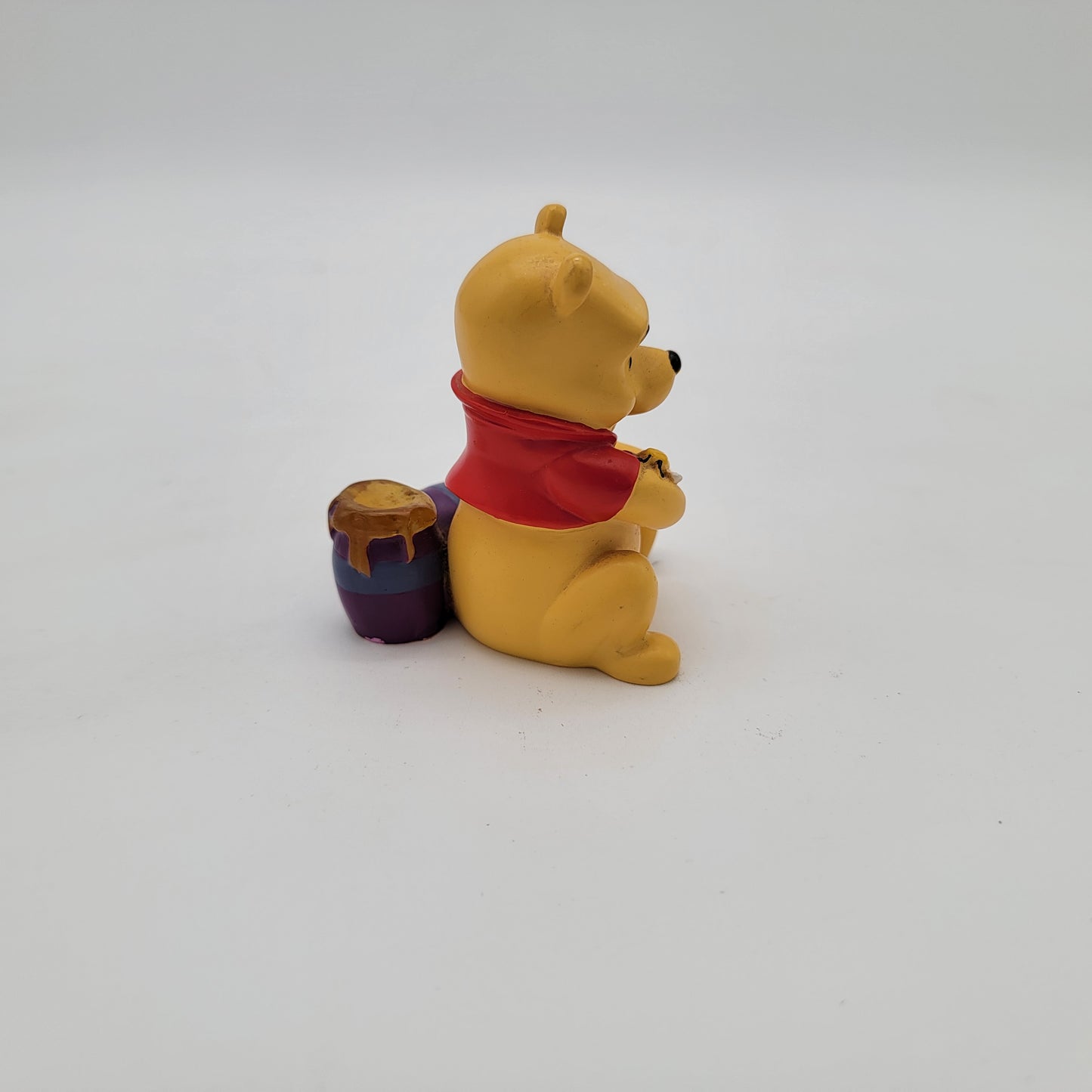 Winnie the Pooh Holding Bee Figurine