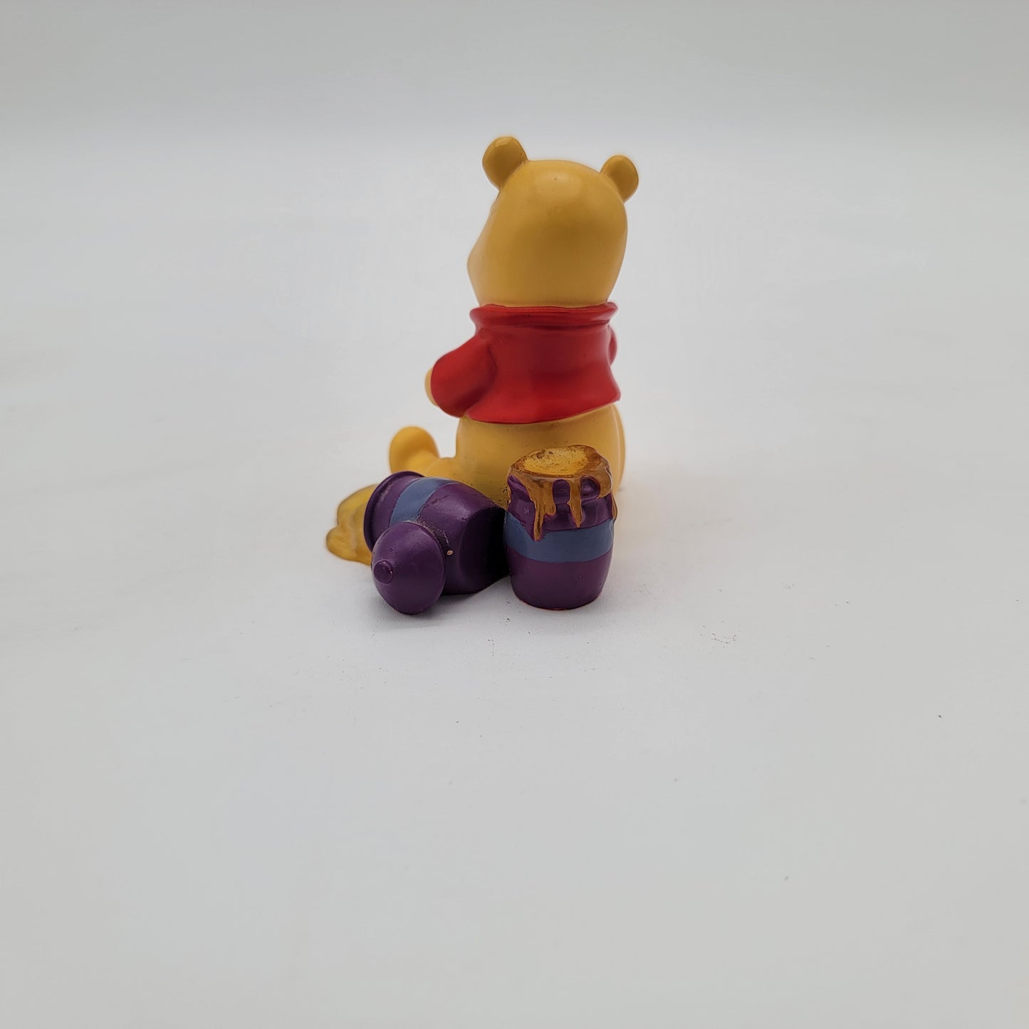 Winnie the Pooh Holding Bee Figurine