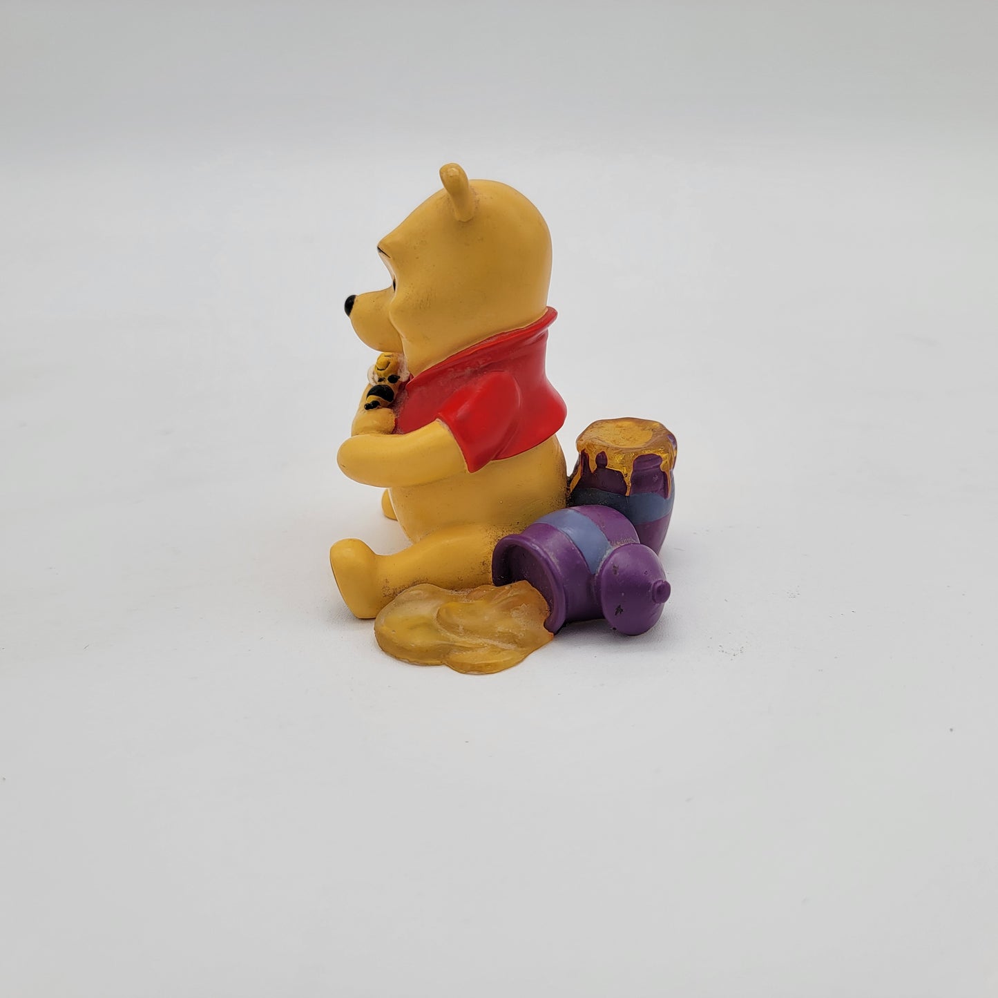 Winnie the Pooh Holding Bee Figurine