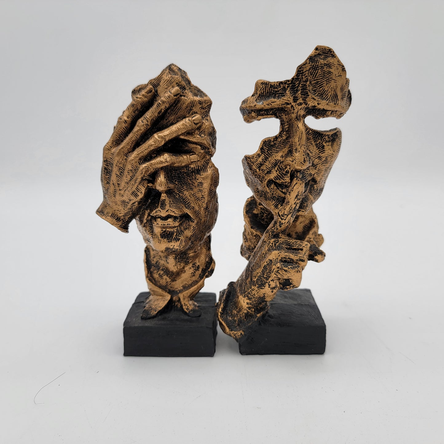 Pair of Abstracr Human Face Statues