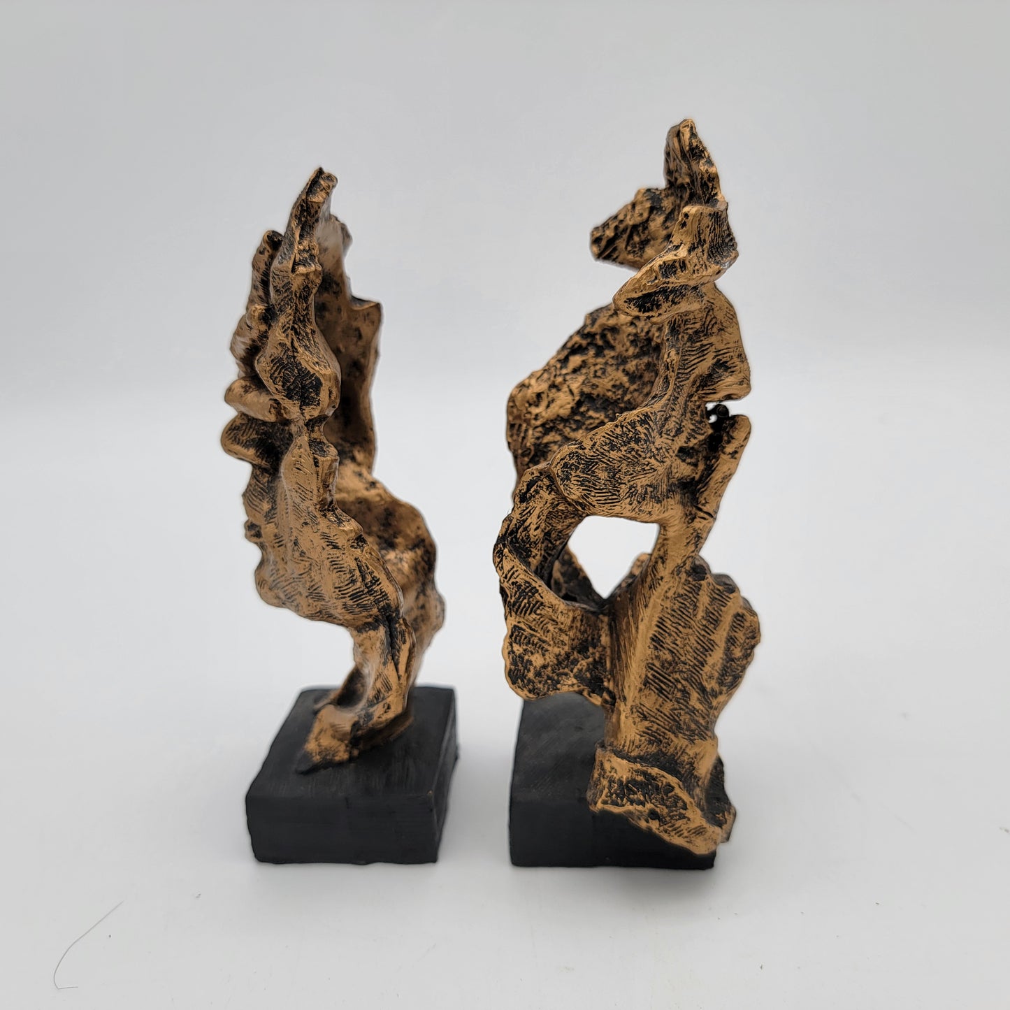 Pair of Abstracr Human Face Statues