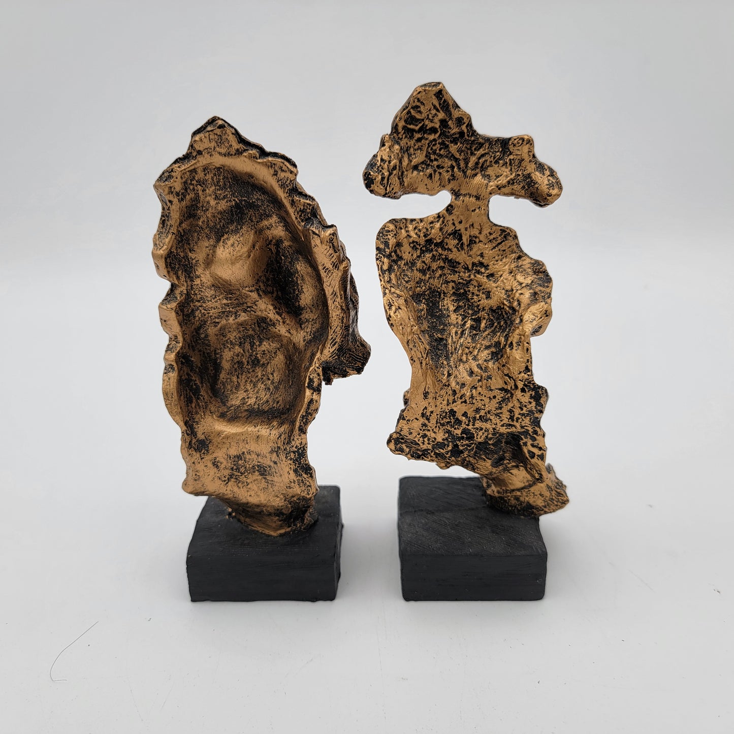 Pair of Abstracr Human Face Statues