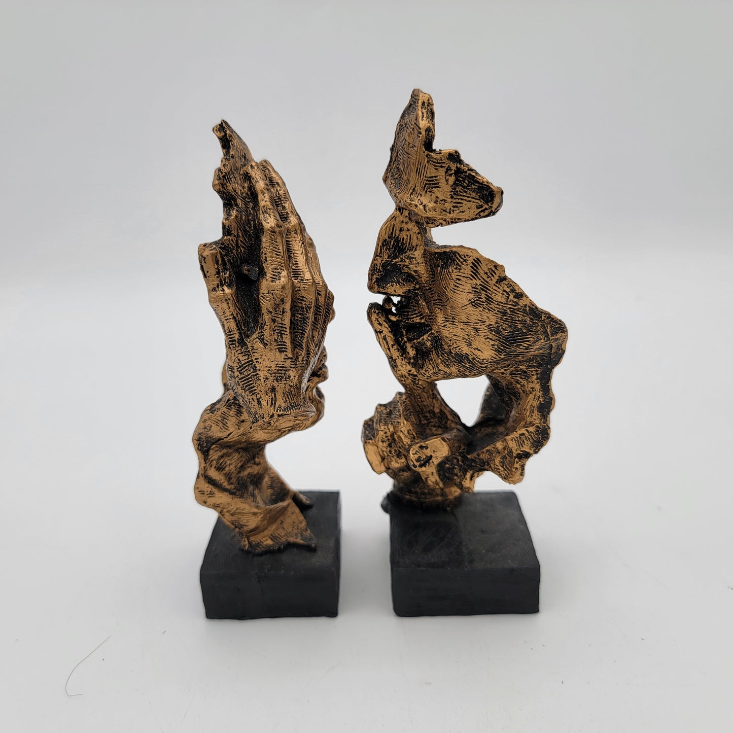 Pair of Abstracr Human Face Statues