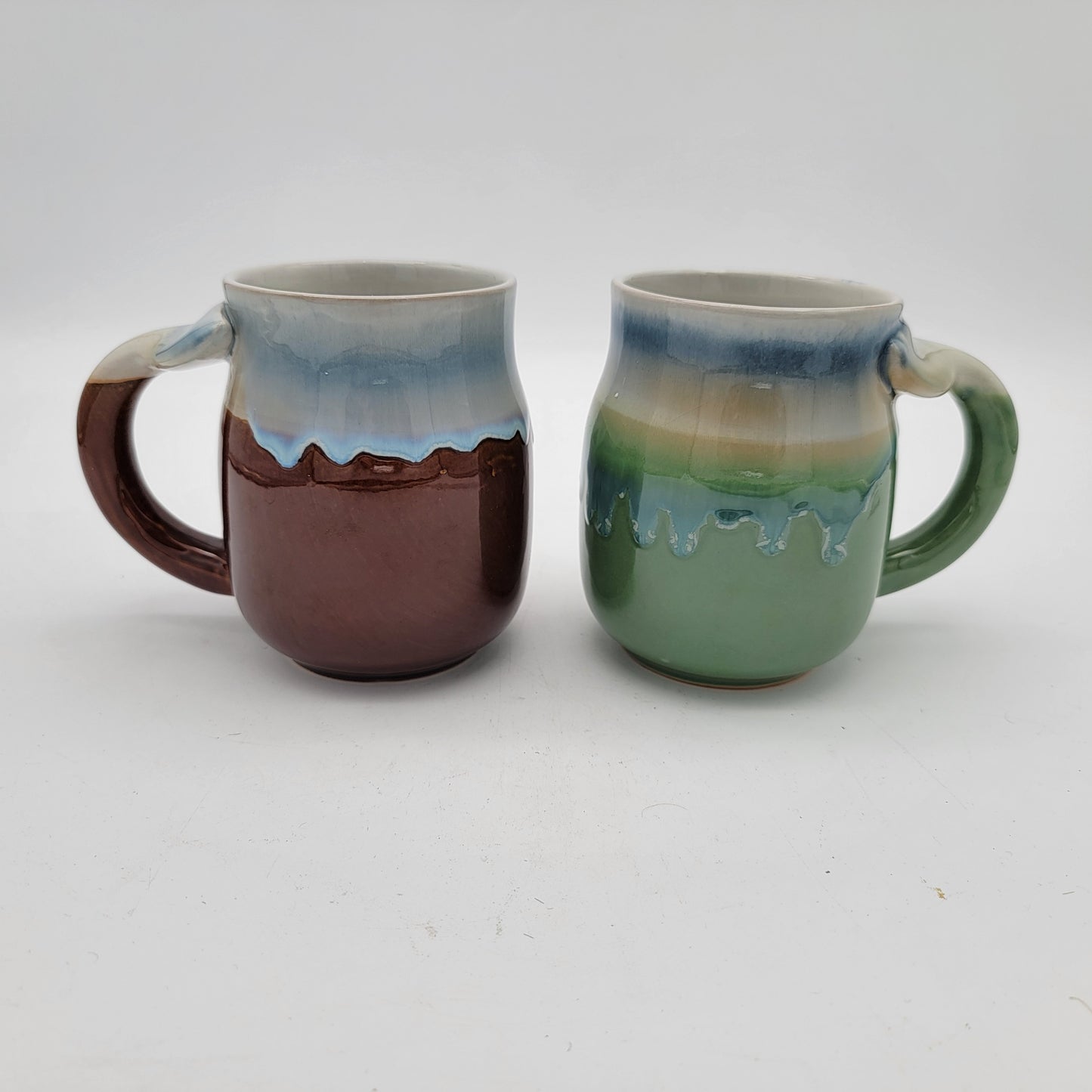 Pair of Art Pottery Whale Tale Mugs