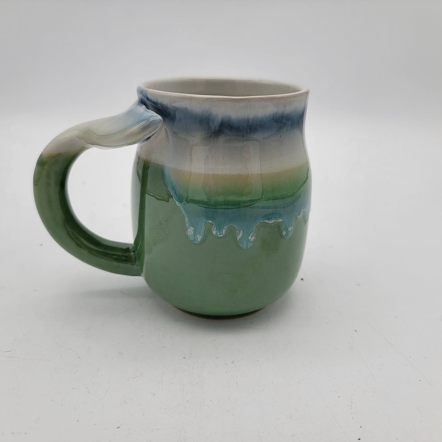 Pair of Art Pottery Whale Tale Mugs