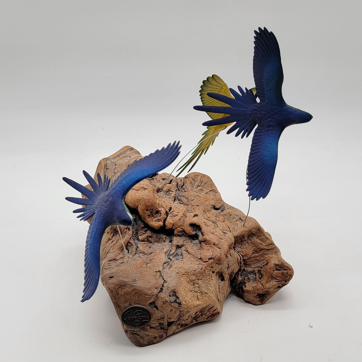 John Perry Blue and Gold Macaw Parrot Trio Sculpture On Burlwood