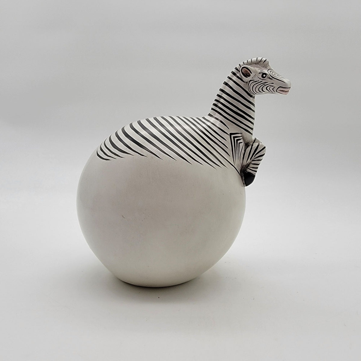 Zebra Hatching From Egg Ball Figurine