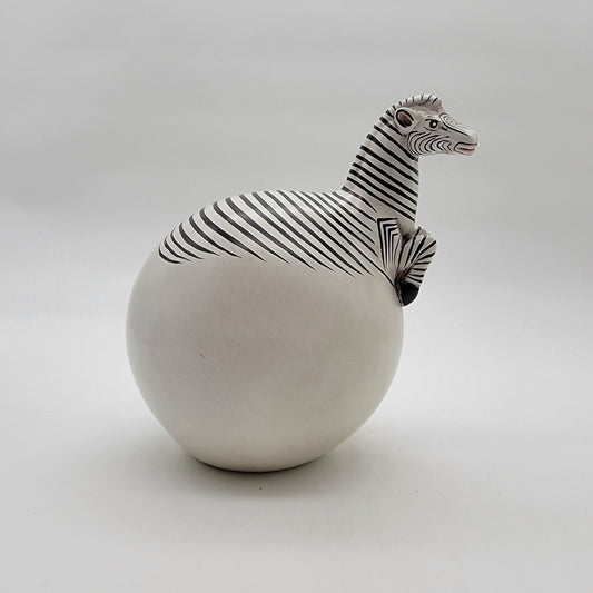 Zebra Hatching From Egg Ball Figurine