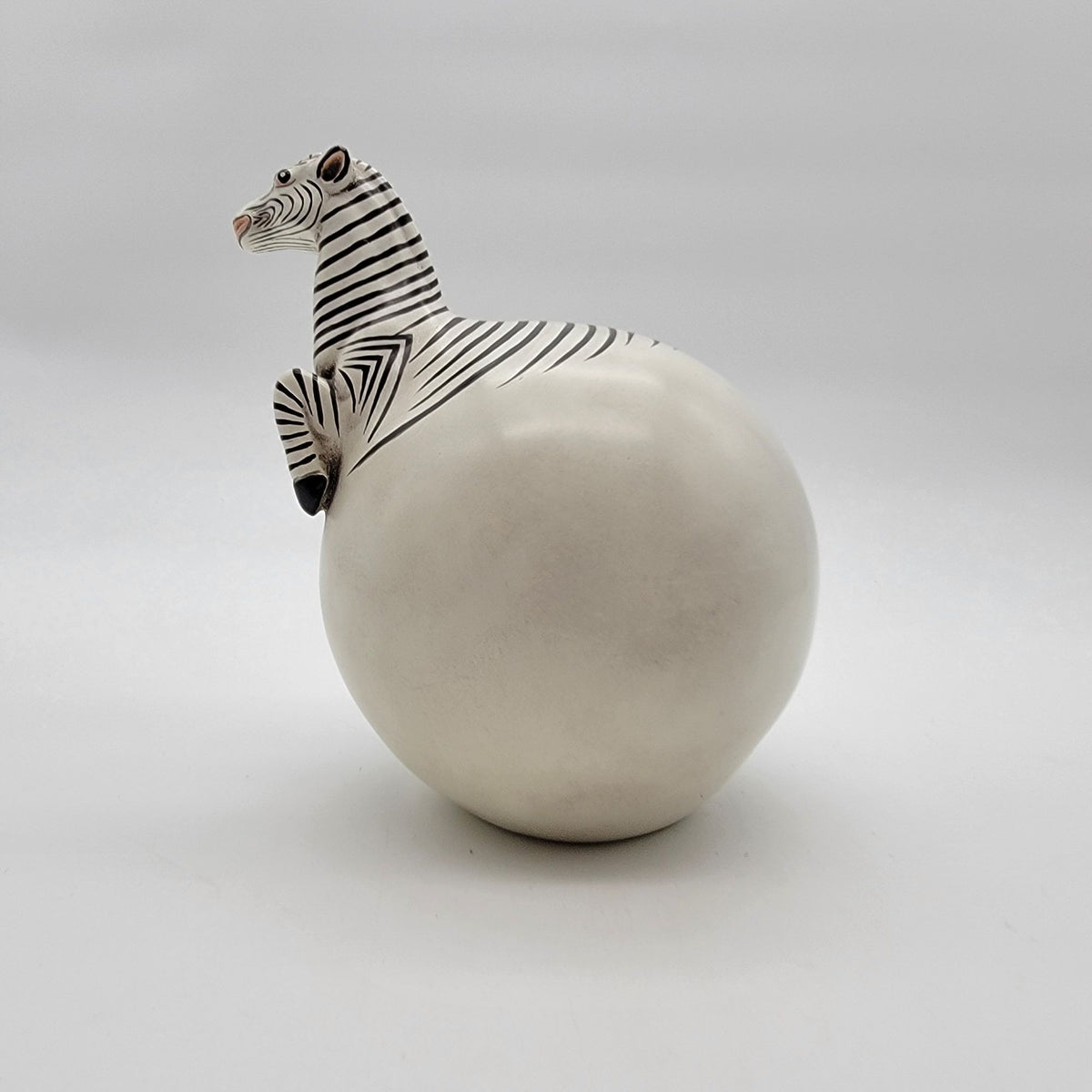 Zebra Hatching From Egg Ball Figurine