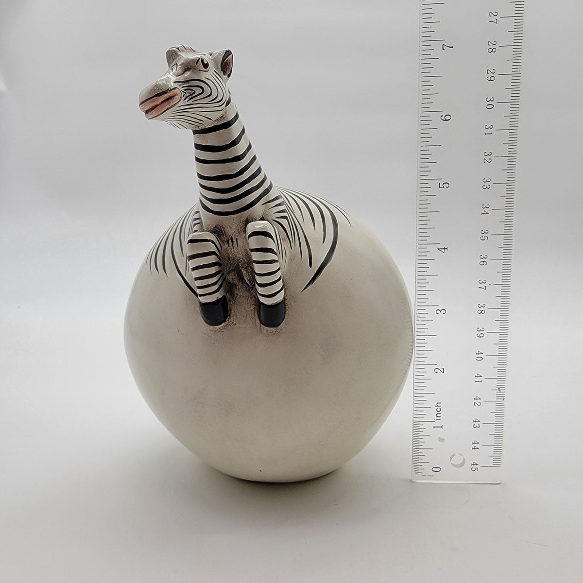 Zebra Hatching From Egg Ball Figurine