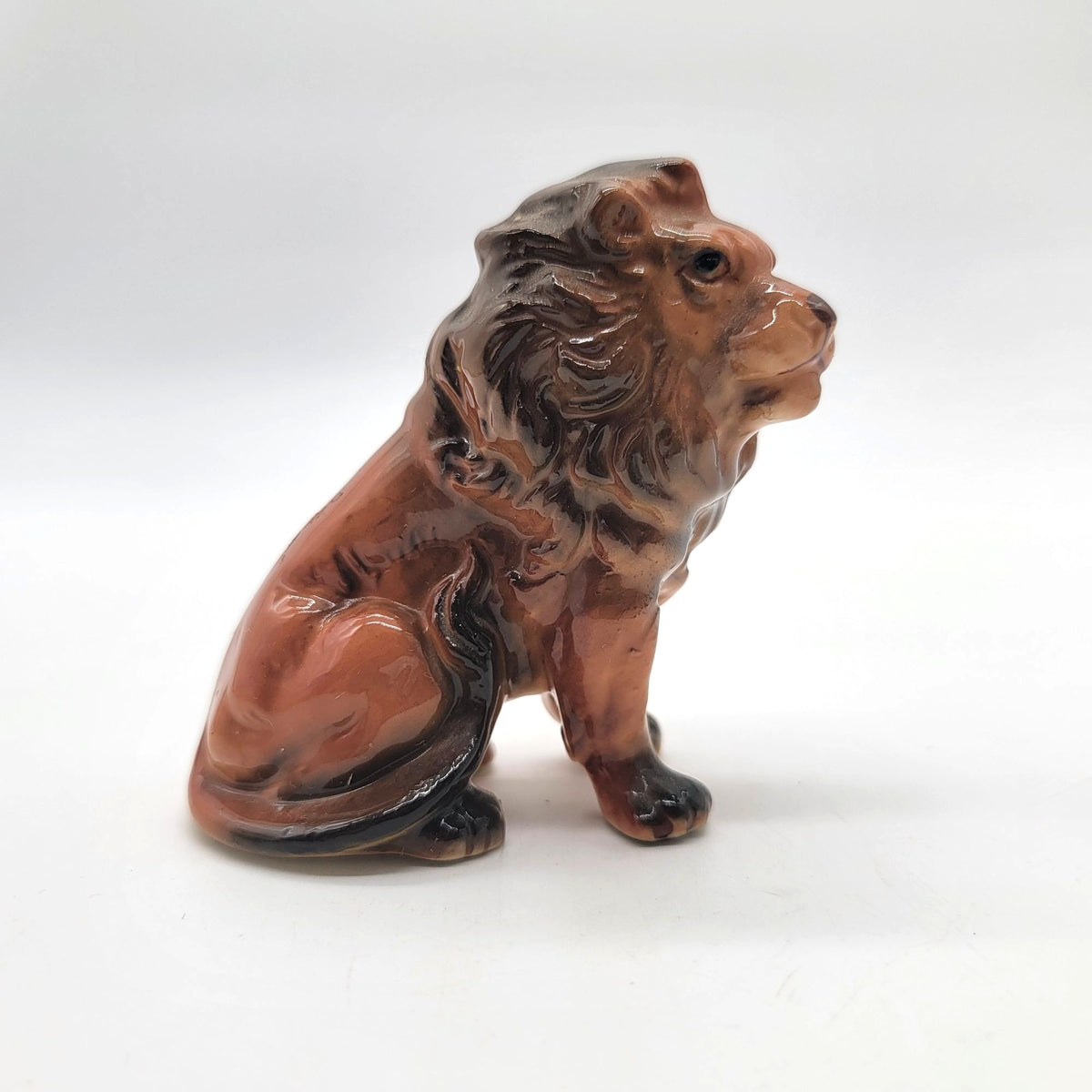 Mid-Century Porcelain Sitting Lion Figurine