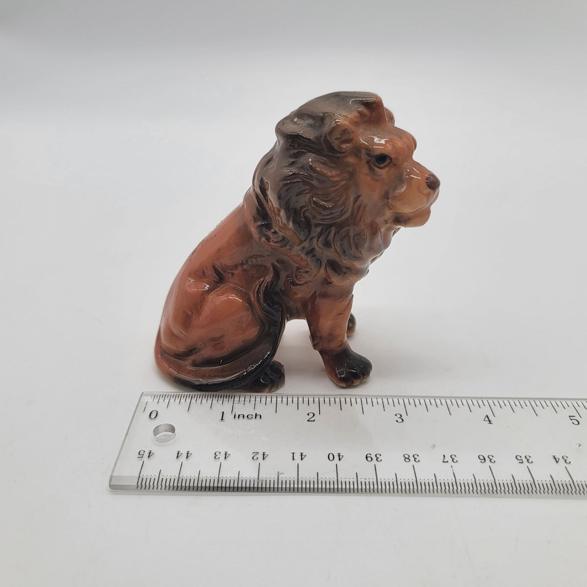 Mid-Century Porcelain Sitting Lion Figurine
