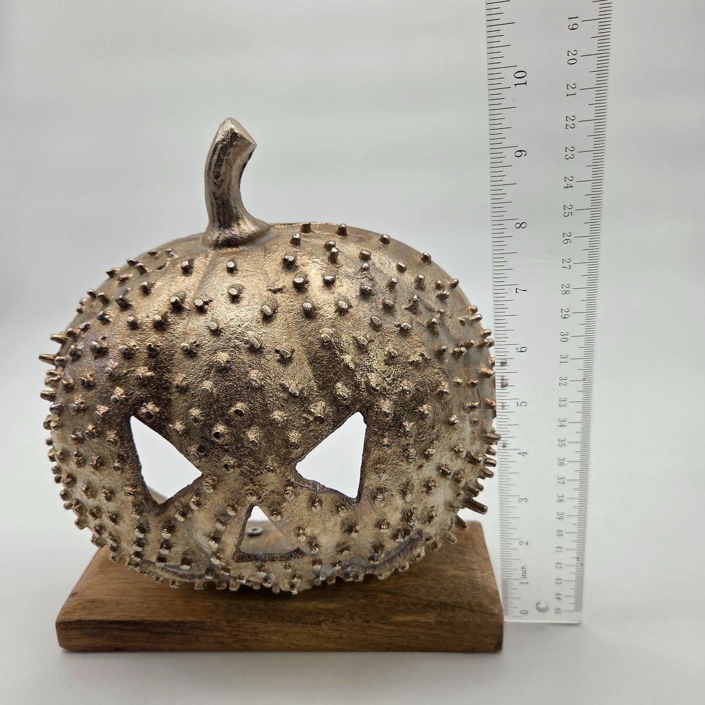 Studded Metal Jack O Lantern Sculpture On Wood Base
