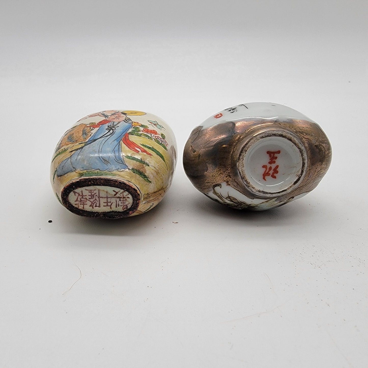Pair Of Vintage Apocryphal Qianlong NianZhi Enameled Porcelain Snuff Bottles With Wood Stand