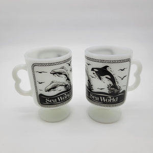 Pair of 1980 Vintage Fire King Milk Glass Sea World Footed Mugs Dolphin Orca Design