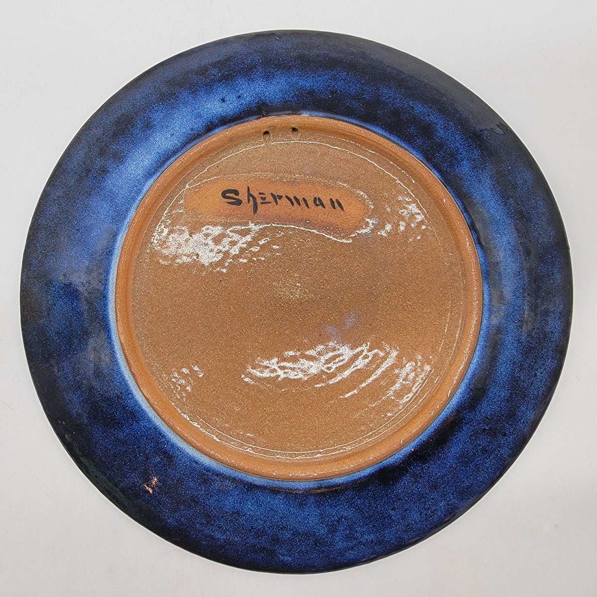 Swirled Blue Glazed Pottery Plate Signed Sherman