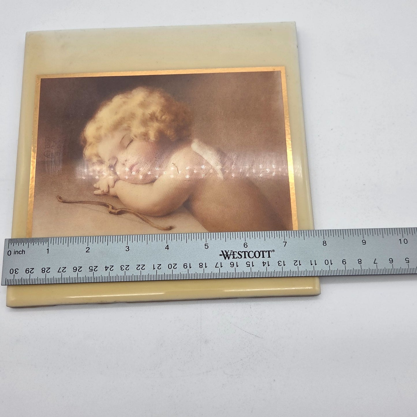 A.R.T. Co. Bessie Pease Guttman Cupid Caught Napping Tile Wall Art